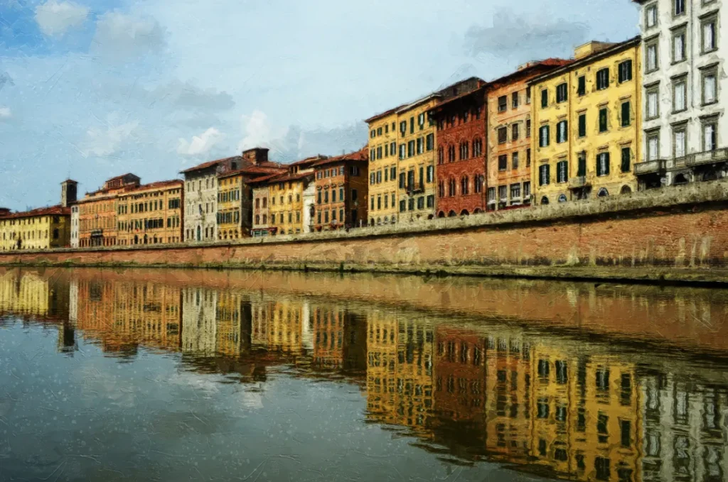 Riverside buildings reflected in the Arno River in Pisa, Italy