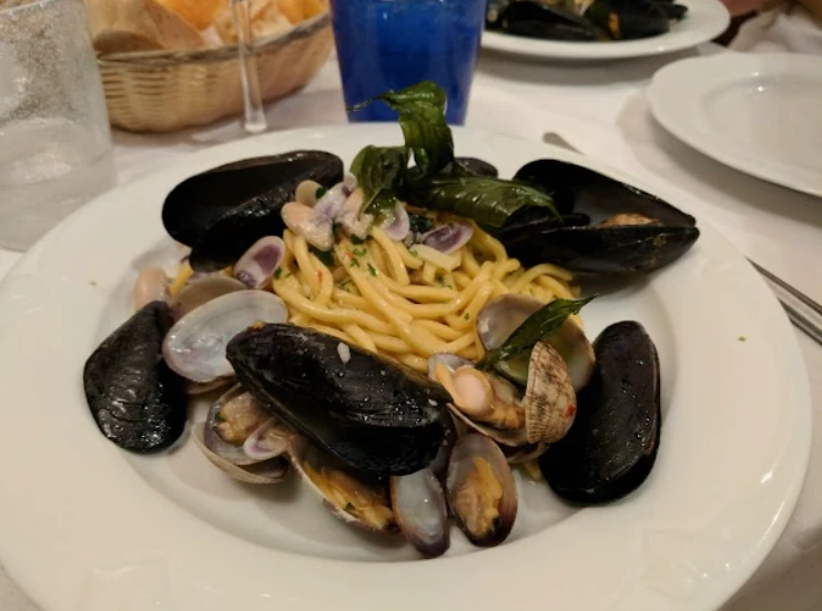 Seafood pasta with mussels and clams served at Osteria dei Cavalieri in Pisa