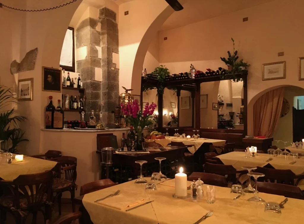 Cozy traditional Pisa wine bar with elegant decor and local wine bottles